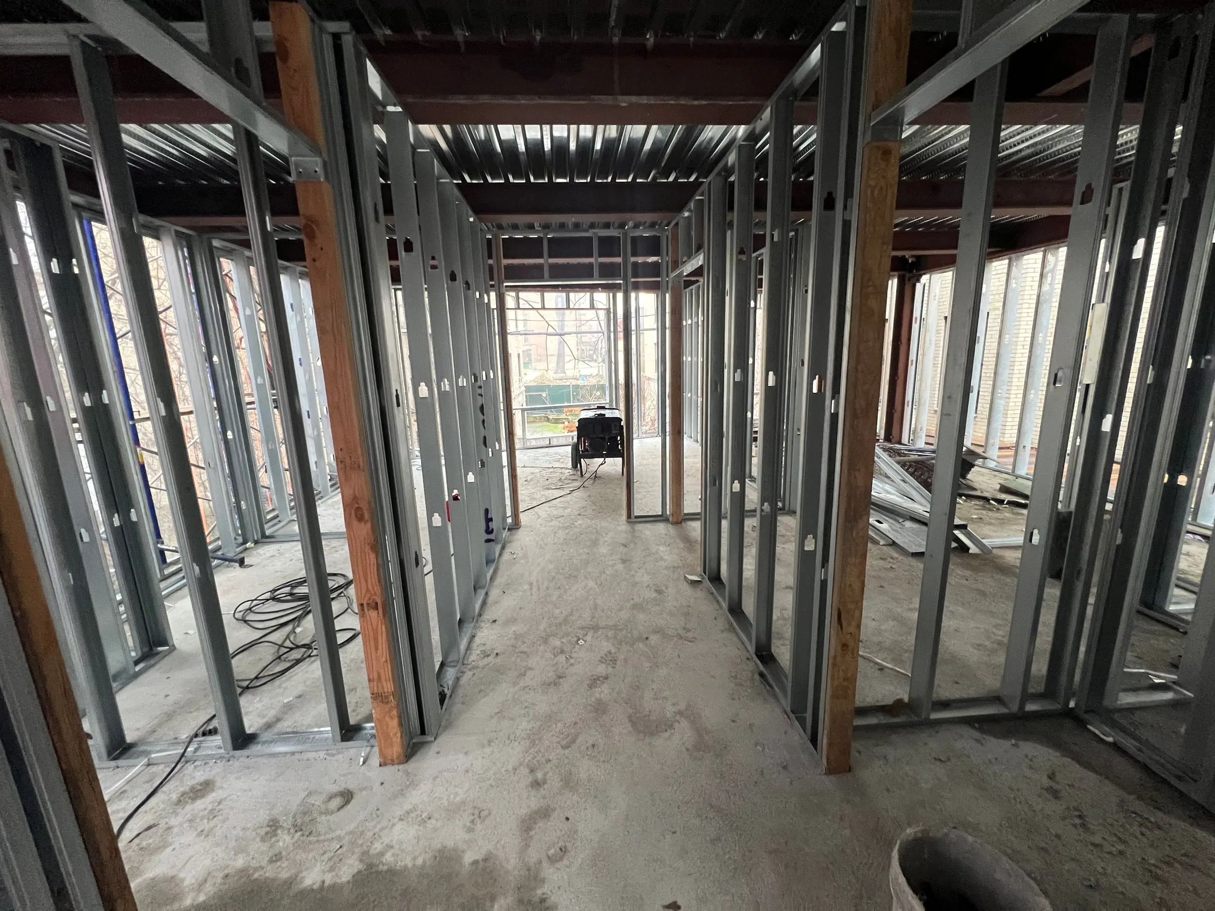 Partitions framed the length of a floor, with the openings already in place.
