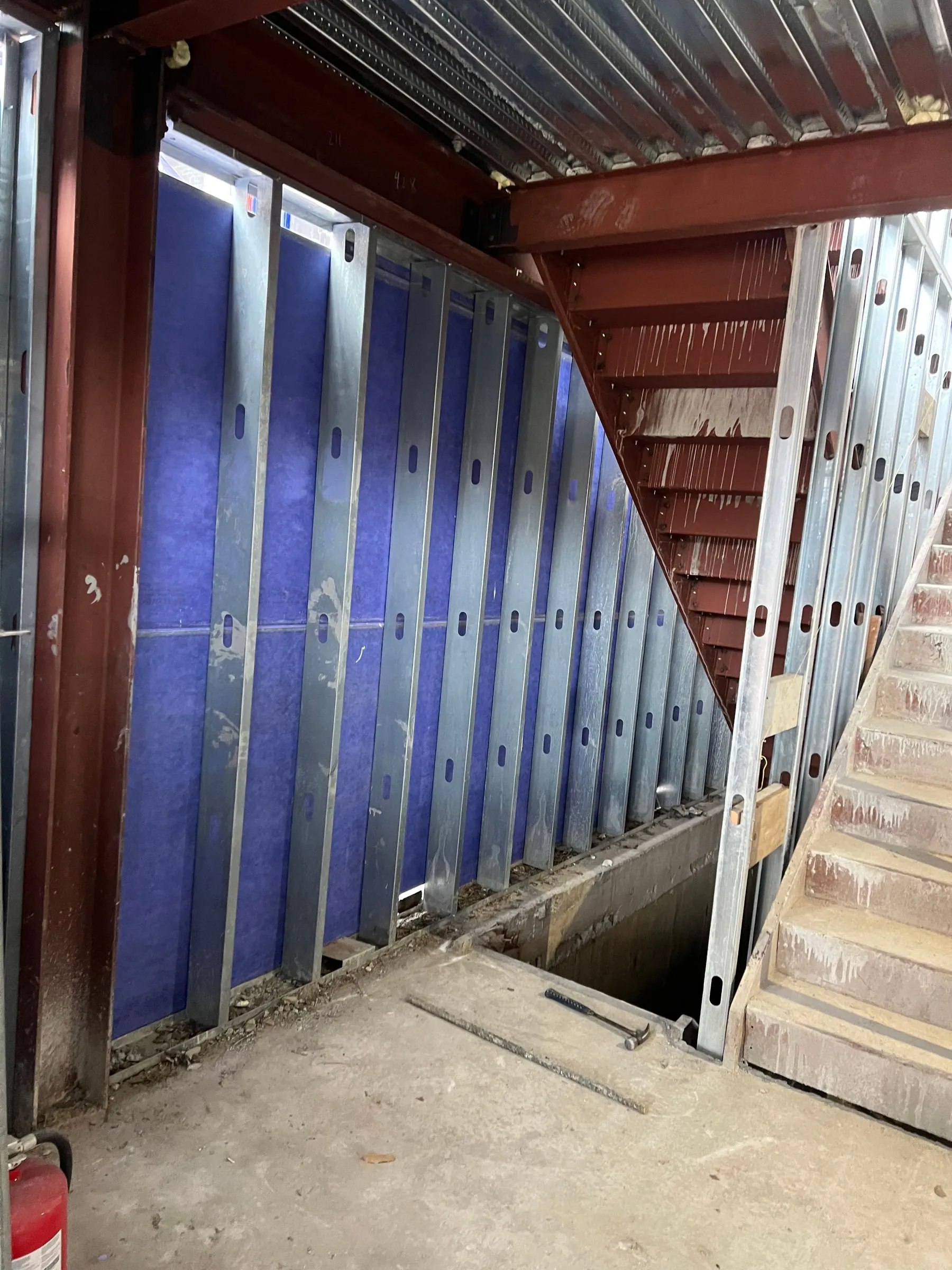 The stair core, with the steel painted and the studs run to the underside.
