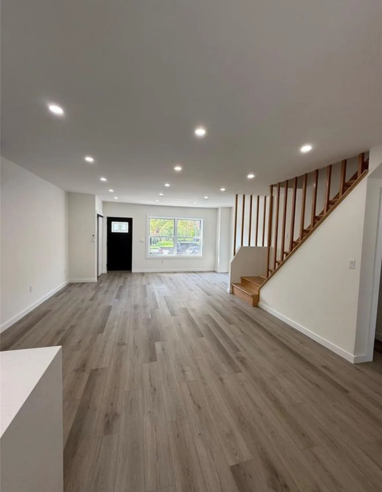 The ground floor opened up, with the stair rebuilt as an open screen.