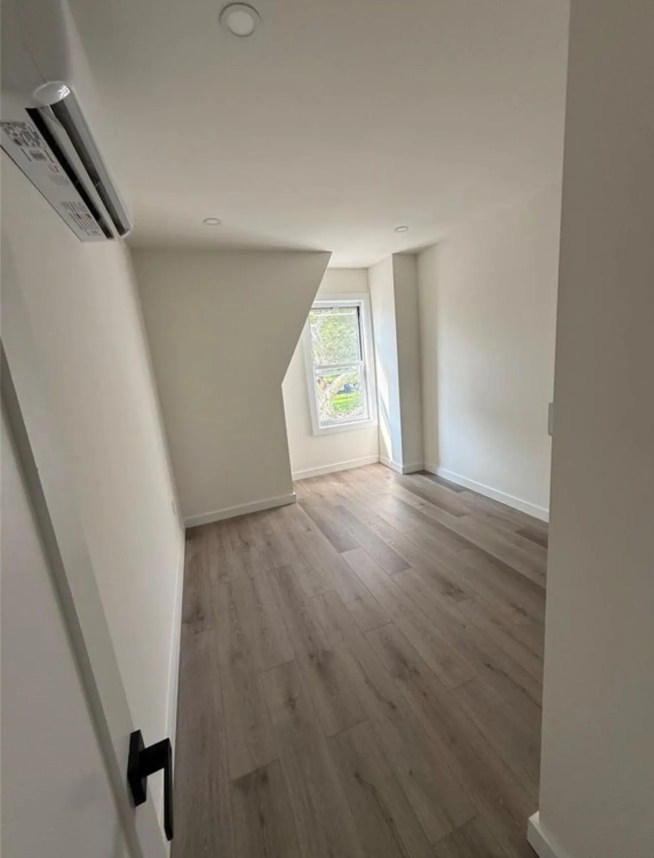 The top floor, where the roof pitch had to be worked with rather than boxed out.