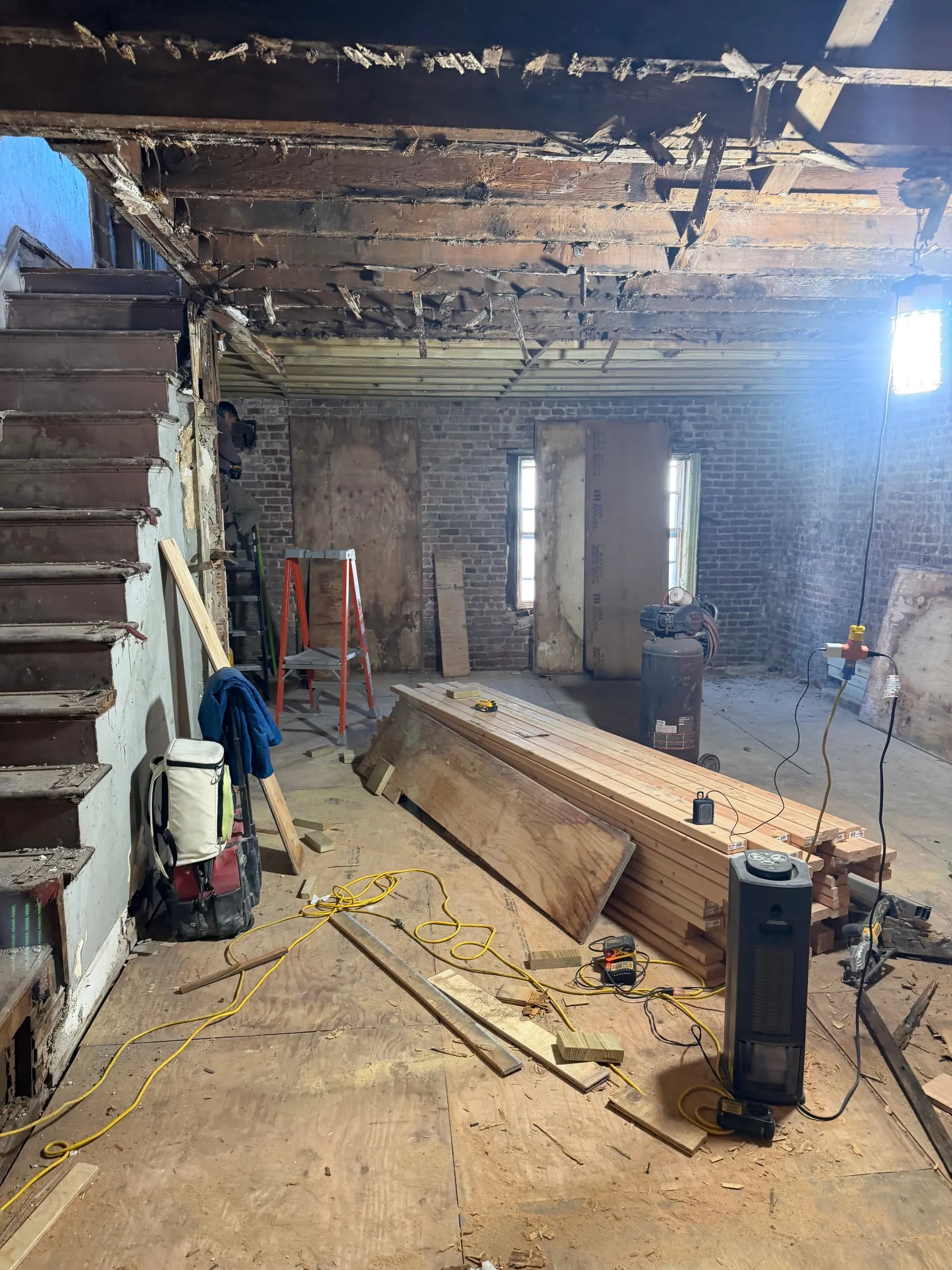 New timber on site and the first of the rebuilding under way.