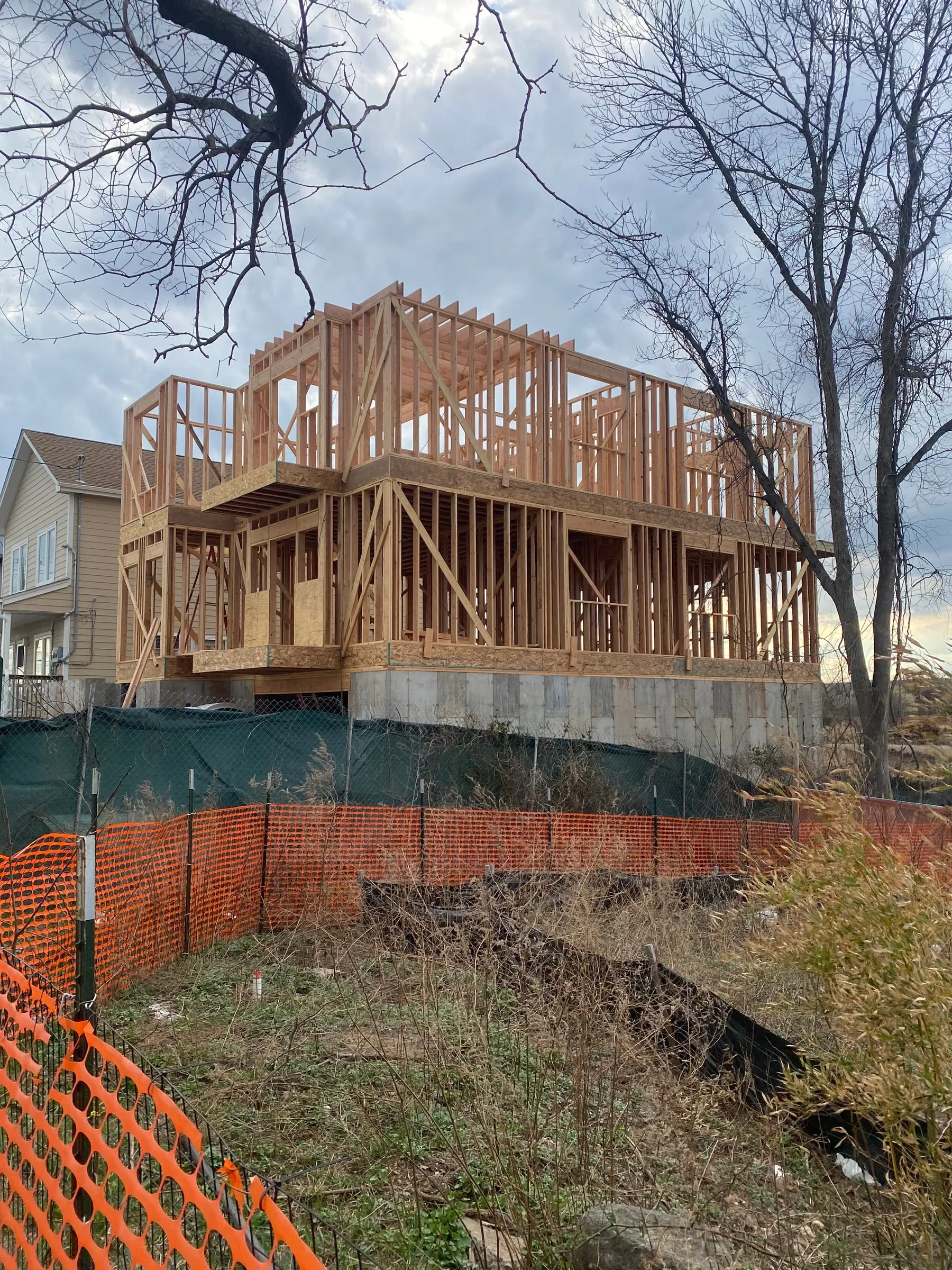 Foundation walls poured and the first two levels framed.
