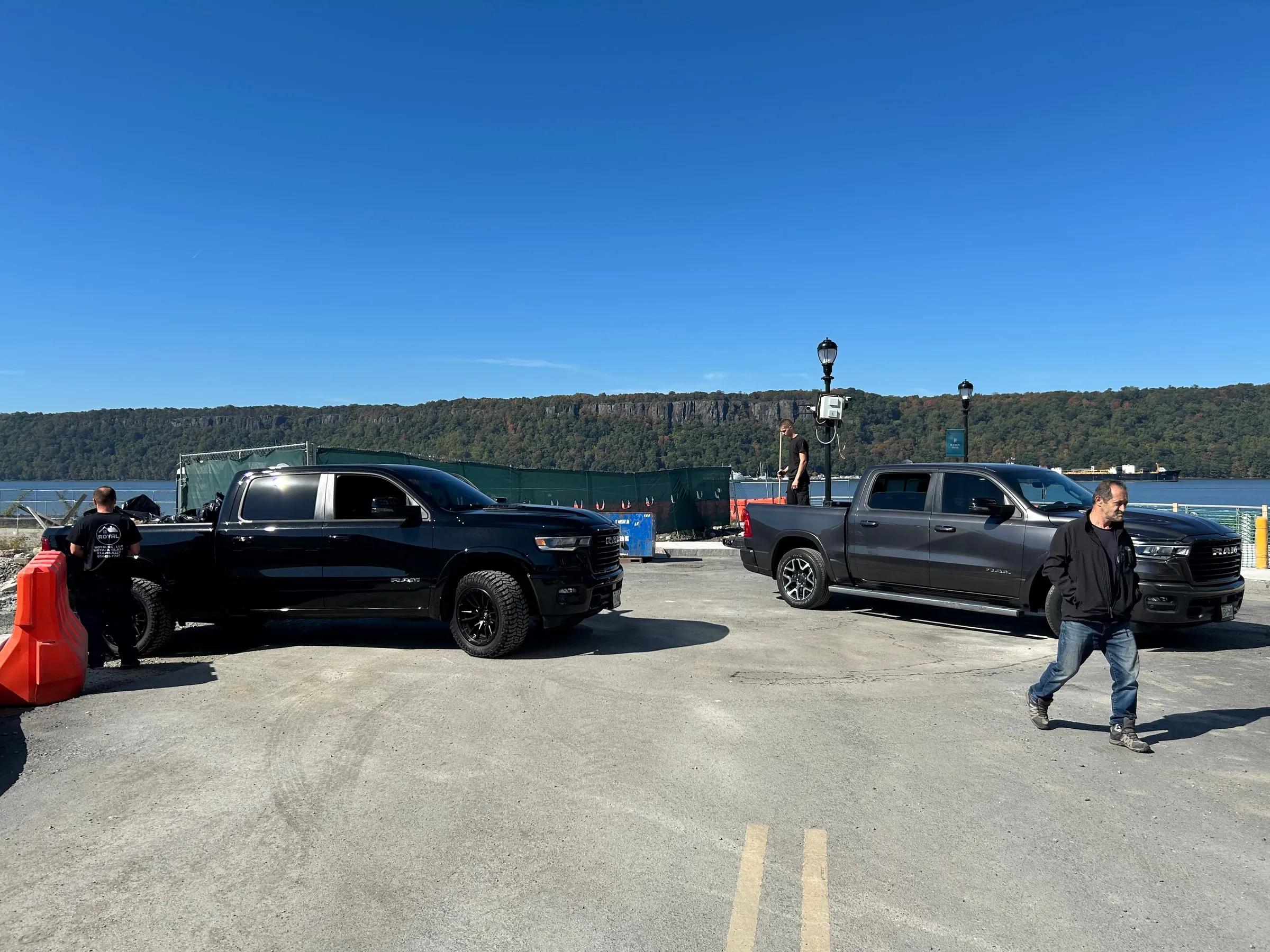 Company trucks parked at a waterfront site north of the city.